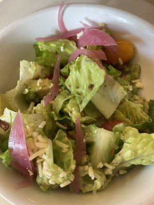 Chop salad w Romaine, pickled onion, aged white cheddar, bacon, tomato, avocado & herb vinaigrette