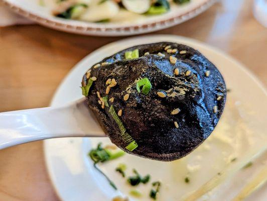 September 5, 2022; Original Shanghainese pan fried soup dumplings w. cuttlefish ink ($11.50).