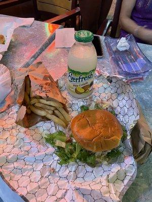 Classic chicken sandwich with fries and a piña colada everfresh