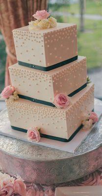 Wedding cake with some pink & white roses