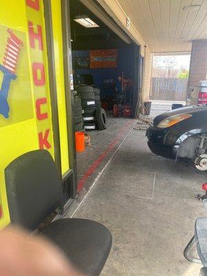 Armando hard at work fixing my tire.