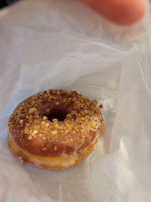 Glazed raised crumb donut, delicious and fresh at the end of the day.