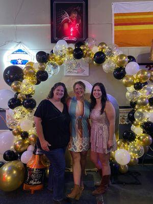 Bar wall decoration with added 50th Birthday arch for our party.