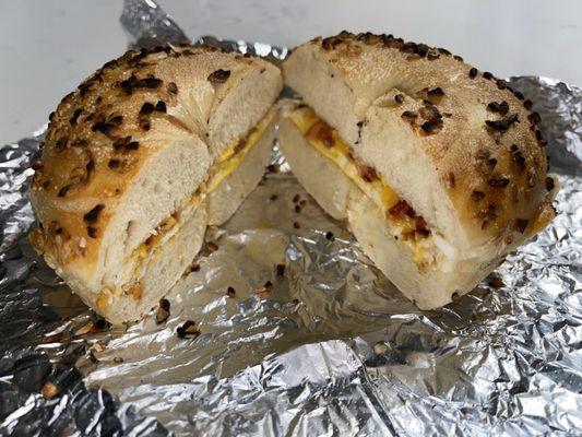 Bacon, Egg and Cheese on an Onion bagel. Bacon/egg are on the skimpy side for $8.