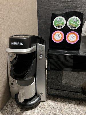 A Keurig and 4 coffee pods in the room. But no creamer or sugars...