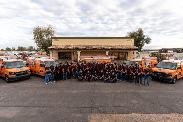 An all staff photo with HVAC Techs, Plumbers, Office Staff, and Management