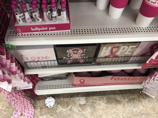 The middle shelf are really nice square wooden plaque for Breast Cancer Awareness Month.