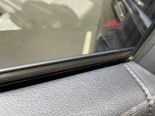 Tint not tucked under window seal