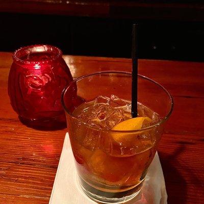 At the bar with an Old Fashioned.