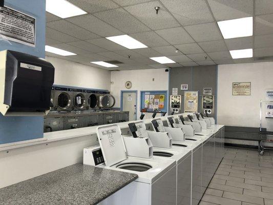 thrifty machines and a view of the back of the laundromat.