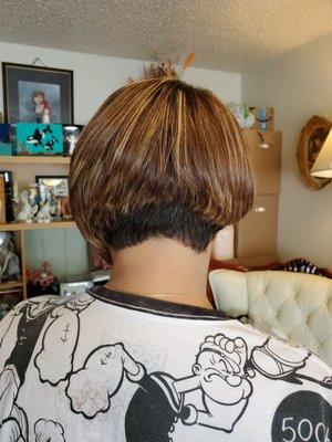 A-line hair cut with beautiful highlights.