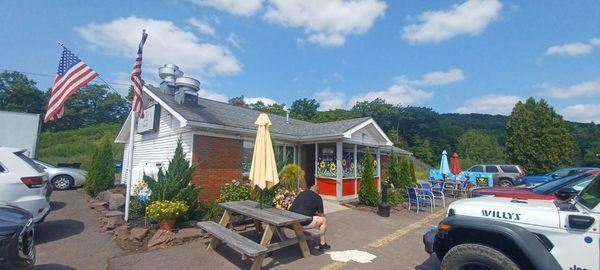 The outside with some outdoor seating.