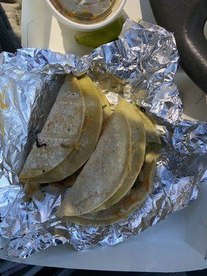 Two cooled soft corn taco with melted cheese and beef birria very good but not spiced enough tomato flavor stronger