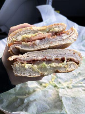 Turkey Club Portuguese Roll (crispy bacon, Swiss cheese, shredded lettuce, tomato, and honey mustard)