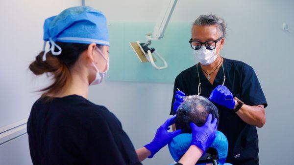 Advanced Hair Restoration Staff working on an Advanced FUE™ Hair Transplant.