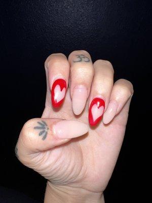 Pointer finger is very crooked, nails are way too long and the design is poorly done with no added top coat on "red" nails.