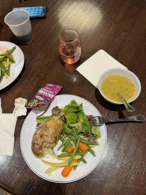 Baked potato, green salad, veggie blend, chicken soup and a complimentary pink moscato.