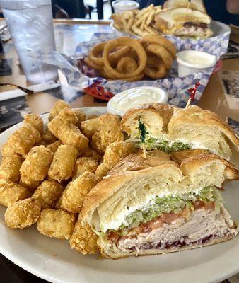 The turkey/cranberry/cream cheese croissant sandwich, very fresh & good $11.99 just wanted more cranberry. Tots cooked perfect!