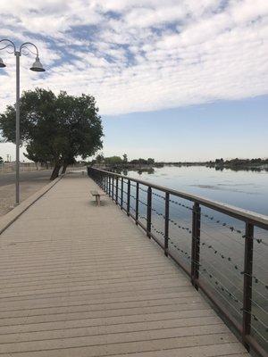 Benches around walking trail in front of the lake