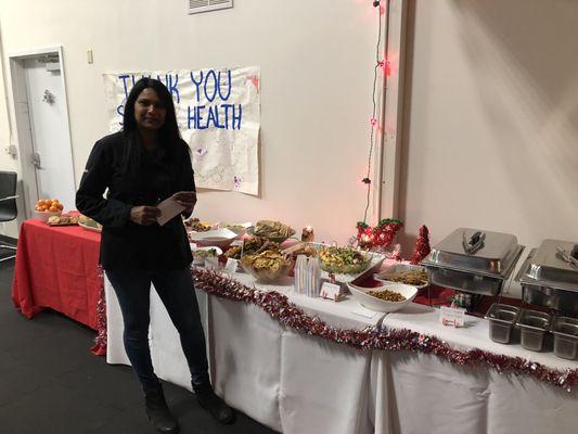 Sarah setting up and catering our company holiday event!