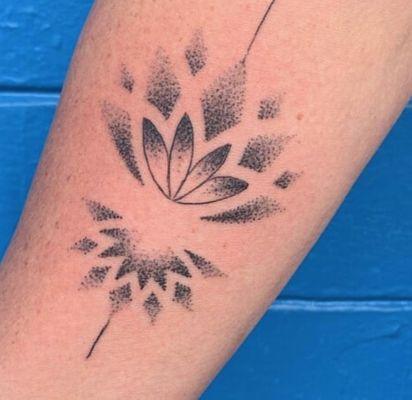 Geometric lotus tattoo by artist Thomas Jacobson.