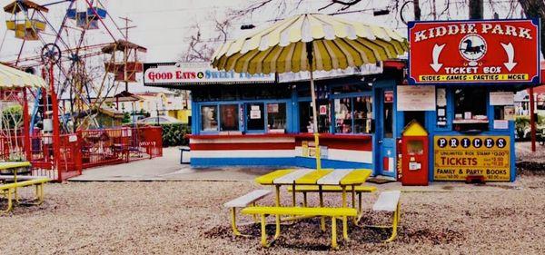 Concession area with tables and umbrellas on most!