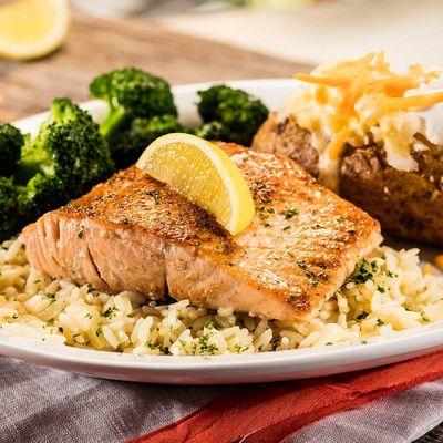 Try our salmon grilled, blackened or bourbon-glazed over rice. Served with two sides.