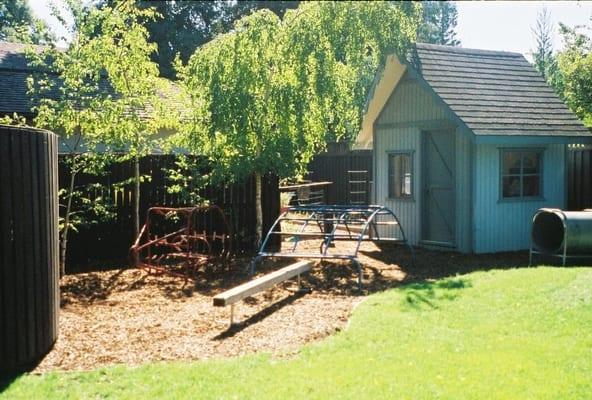 grass yard with our playhouse