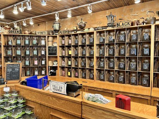 Tea wall behind the register.