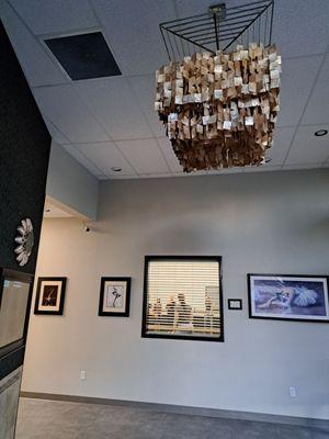 Lobby with fnacy chandelier and a window inside a dance studio