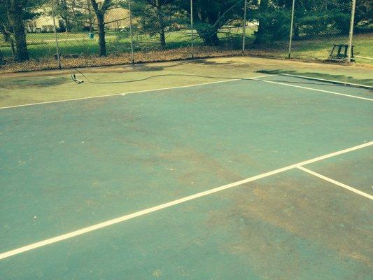 Princeton tennis court prior to powerwash