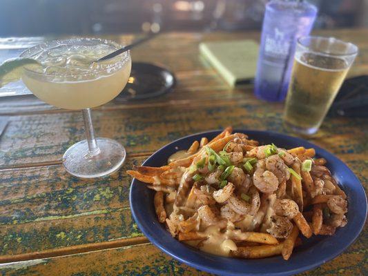 Fries with lobster cheese sauce and blackened shrimp