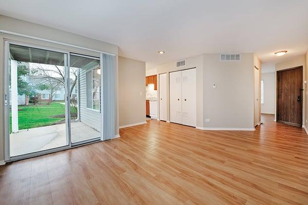 Magnolia living room with separate dining area and access to private patio