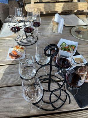 Love how the wine was delivered like a flight. The food was excellent. Pretzels. Brie. Veggies. Yum.