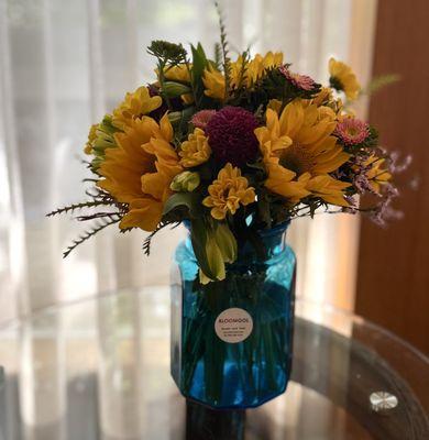 sunflowers in a blue vase for him and dad and grandpa