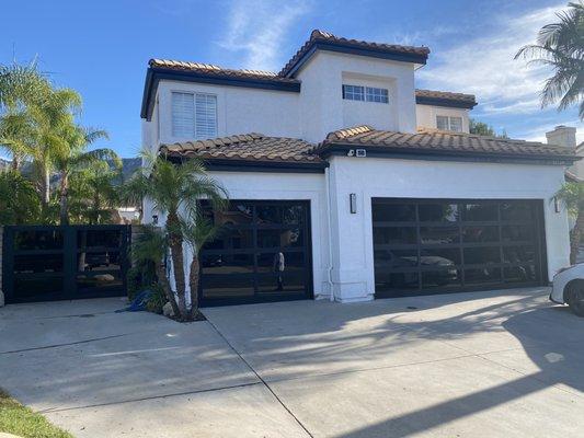 Remodel with new garage doors, and custom gate