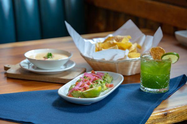 Start the perfect meal with guacamole and queso!  The perfect combination with house chips and signature verde margarita.