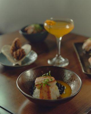 Assortment of dishes and Silk Road signature cocktail