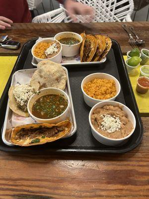 A spread full of delicious bites including the Quesabirrias, Gorditas, and Taco de Guiso!