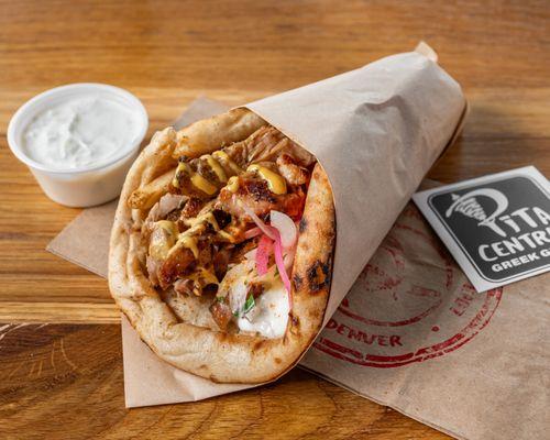 A delicious pita wrap with grilled chicken.