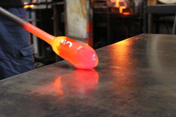 Shaping the glass on a metal table called a marver