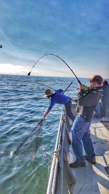 One of the guys catchn a fish and the deckhands gettn ready to net it 8/20/20