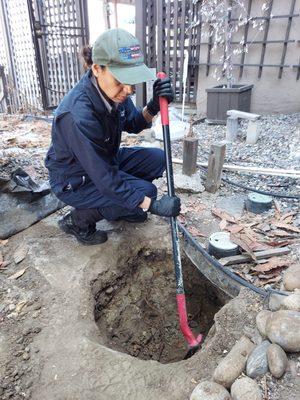 Repairing roots in the sewer.