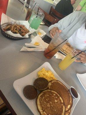 Tropical mimosa, pitcher of the da, chicken nuggets, pancakes, Philly cheesesteak