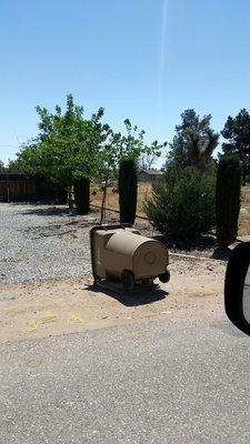 How Advance Disposal services my neighbors home.  4th house of the day, left with trash cans tipped over.