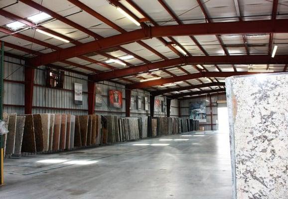 Choose from hundreds of colors in our 55,000 square foot slab selection area.