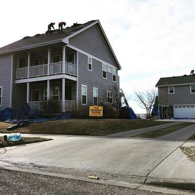 North West Roofing crews make sure that yards are protected to help keep all the debris from being in the grass and bushes!