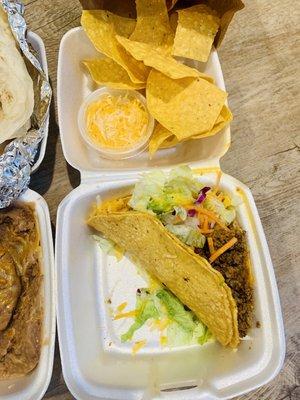 Crunchy ground beef taco & fresh chips.