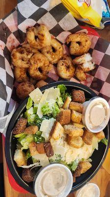 Blackened grilled shrimp with hush puppies and a side Cesar salad.  Side of cole slaw.