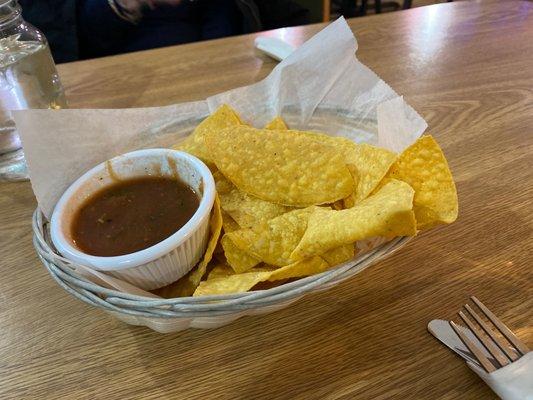 Nachos and mild salsa brought to the table immediately when we sat down